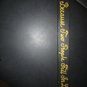 Black and Gold Decorative Sign